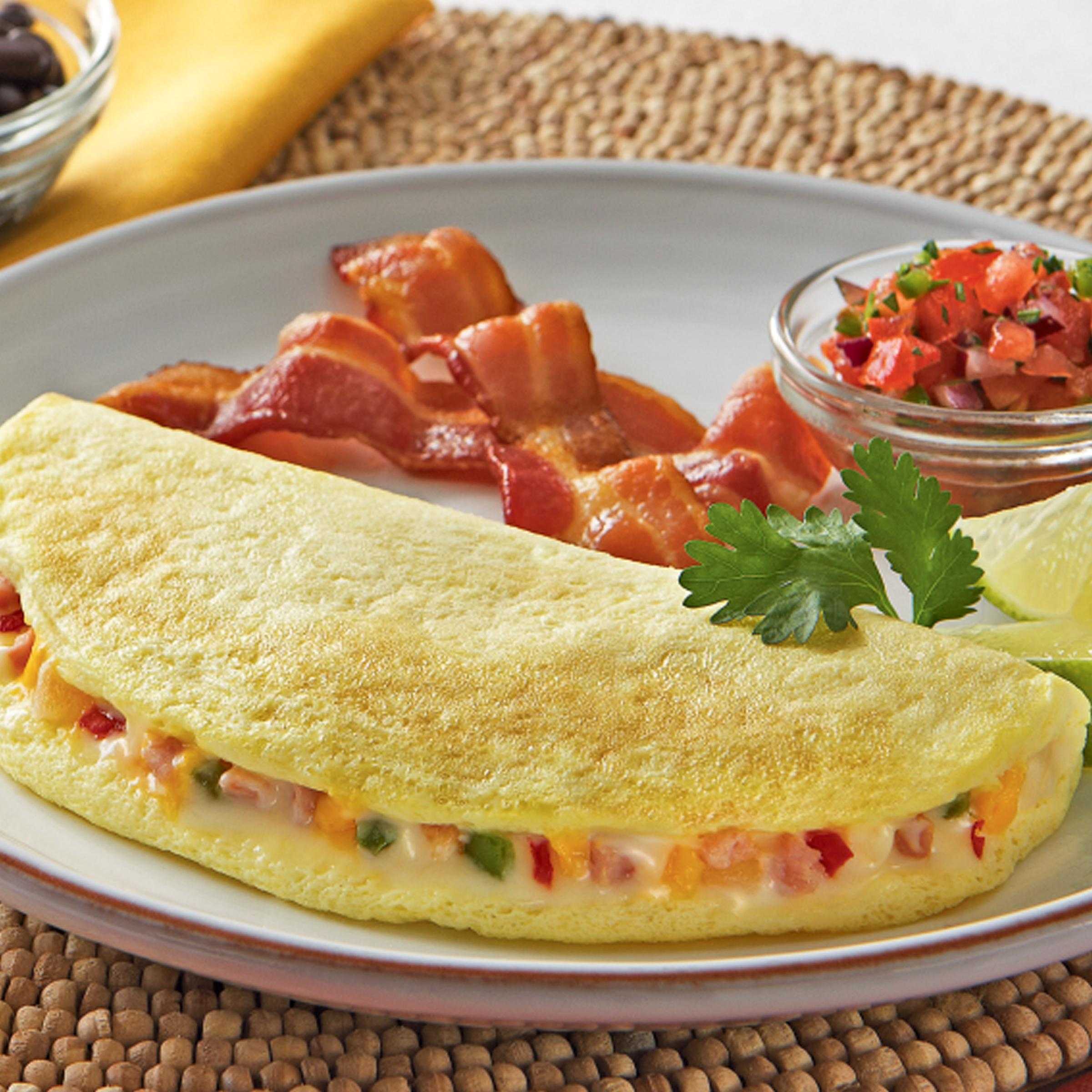 Papetti’s® Fully Cooked 6″x 3″ Singlefold Omelet filled with Cheddar Cheese, Monterey Jack Cheese, Ham, Onion, Green and Red Peppers